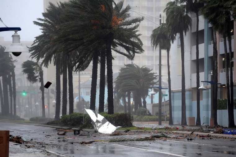 Image: Debris flies through the air as the eye of Hurricane Matthew nears Daytona Beach