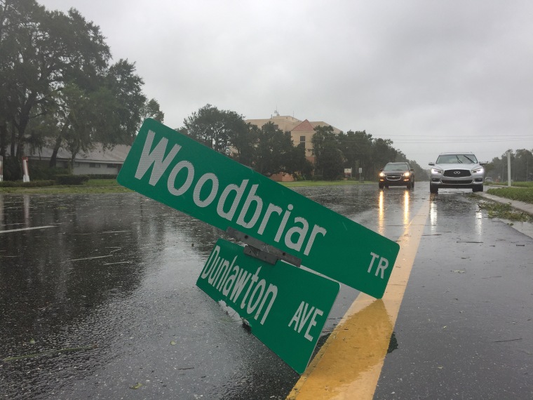 A street sign lies in the road on Oct. 7 in Daytona Beach, Florida, after the area was hit by powerful winds from Hurricane Matthew.