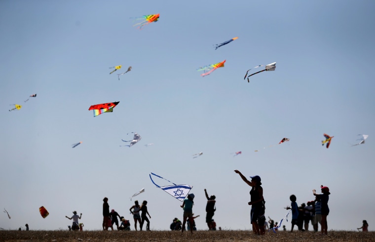 Image: Israelis fly kites during Rosh Hashanah holiday