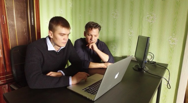 Richard Engel talks with Vladimir Fomenko, the owner of Internet hosting company King Servers, in Biysk, Russia.