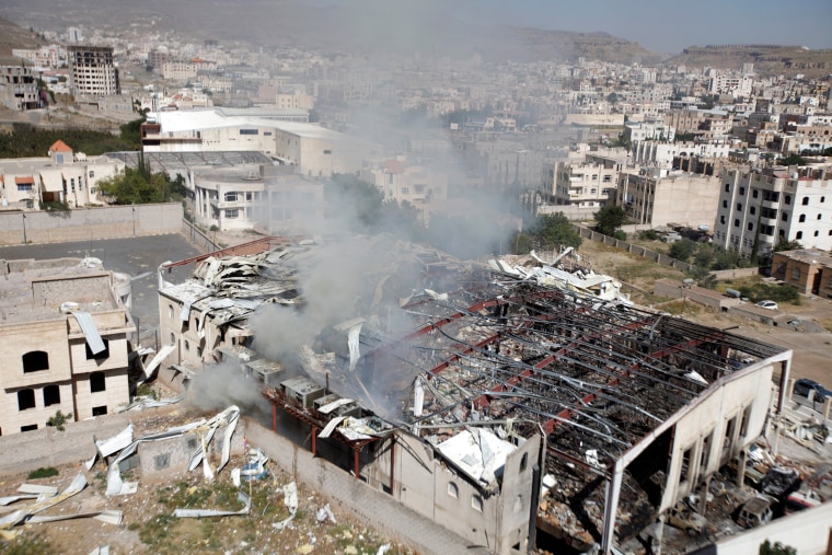 Image: Smoke rises from community hall where Saudi-led warplanes struck funeral in Sanaa, the capital of Yemen