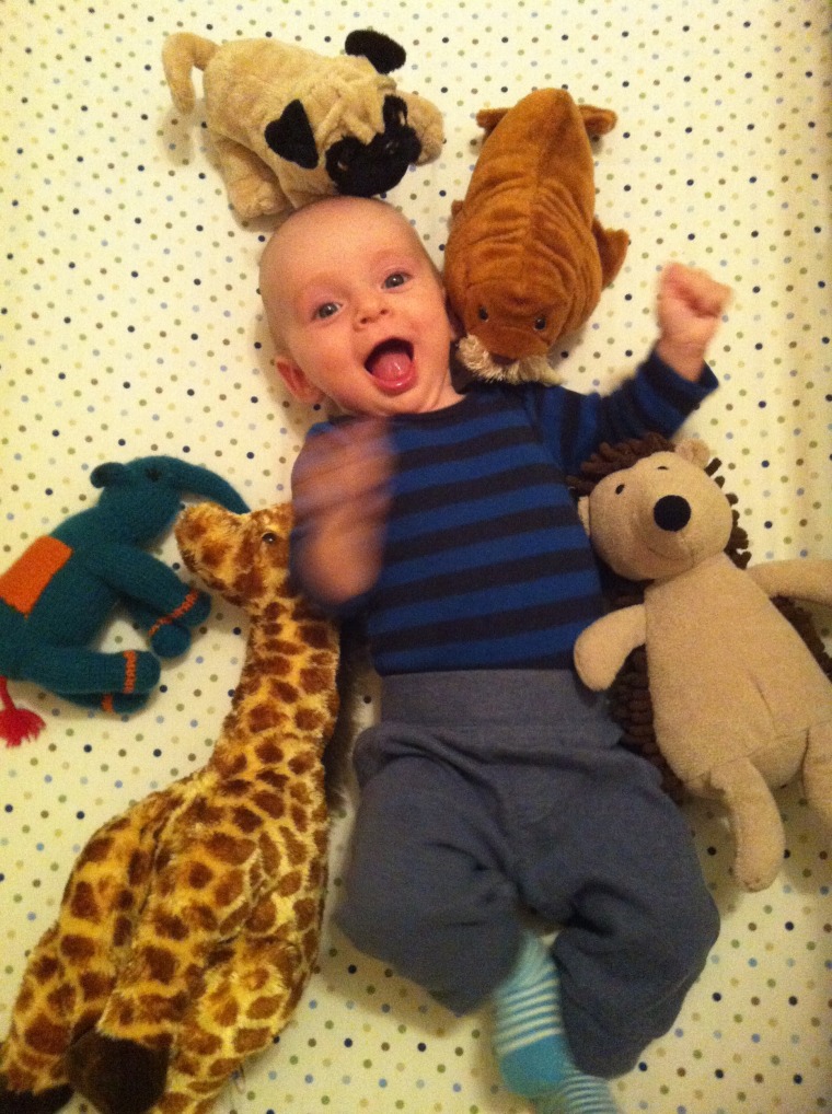 Theo loved to flail and laugh in his crib, but showed no signs of standing up or wanting to walk. 