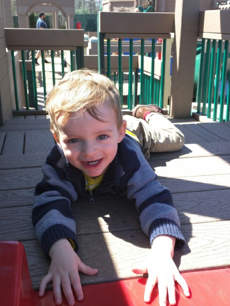 Even at 2 years of age, walking was out of sight. At the playground, Theo preferred sliding on his belly to get down the slide.