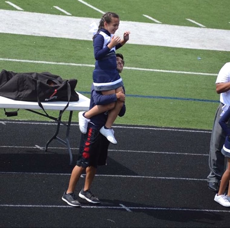 Cheerleader helped by hs student