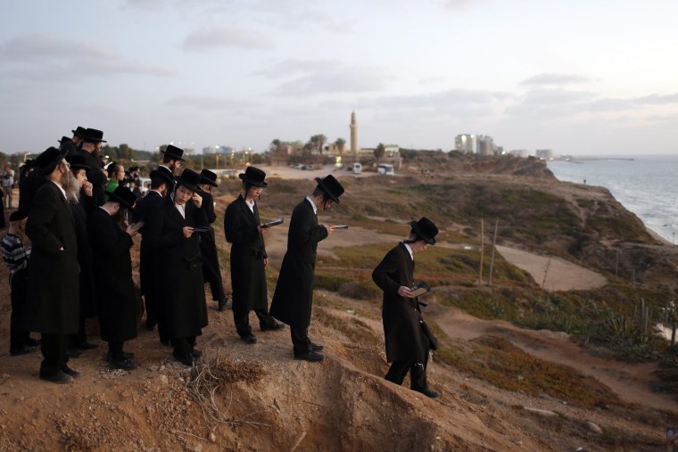 Image: Tashlich ritual at the Herzliya beach outside Tel Aviv, Israel