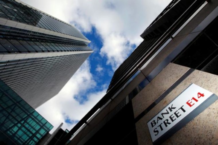 A sign for Bank Street and high rise offices are seen in the financial district in Canary Wharf in London