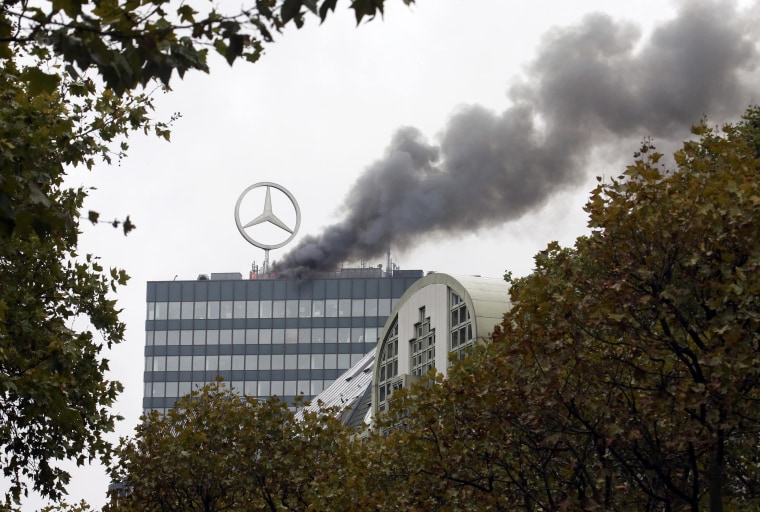 Image: Smoke and fire is seen on the roof of the Europa-Center building in Berlin