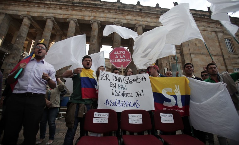 University students and supporters of the peace deal signed between the government and the Revolutionary Armed Forces of Colombia (FARC) rebels protest with a sign reading "Stop War" in front of Congress in Bogota, Colombia, October 3, 2016.