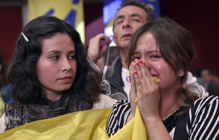A woman cries after knowing the results of a referendum on whether to ratify a historic peace accord to end a 52-year war between the state and the communist FARC rebels, in Bogota, Colombia, on October 2, 2016.