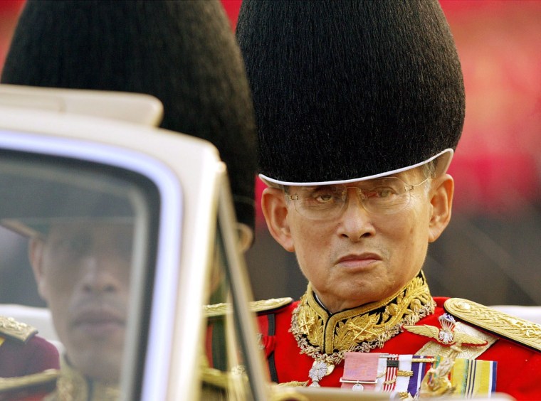 Image: A 2003 file picture shows Thailand's King Bhumibol Adulyadej as his son, Crown Prince Maha Vajiralongkorn, looks on