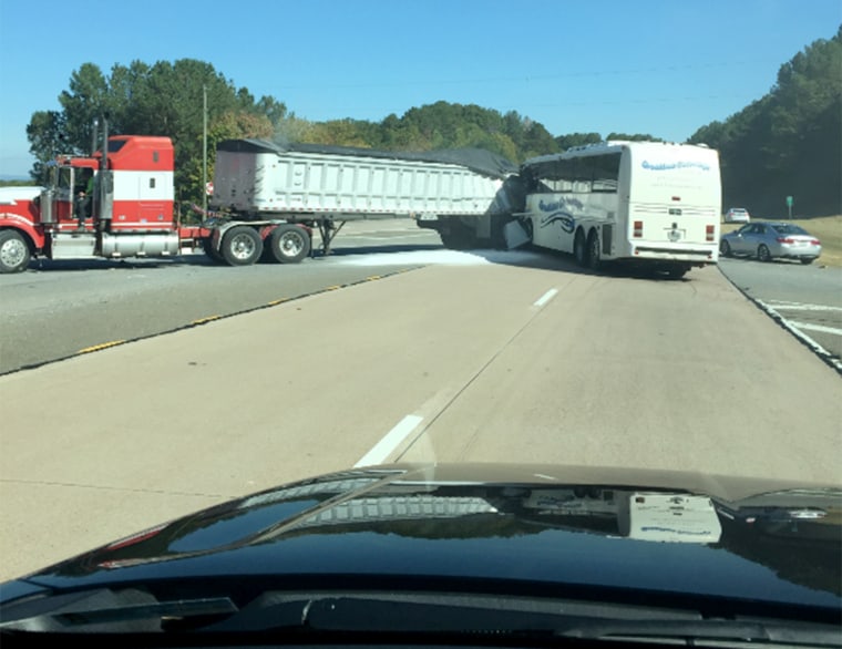 One person was killed and up to 40 others were injured in an accident involving a tractor-trailer truck and a tour bus Thursday, according to Gilmer County's fire chief.