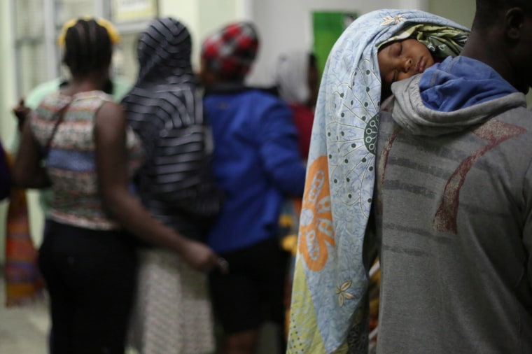 Image: Haitian migrants line up before sleeping inside Padre Chava shelter after they left Brazil, where they relocated after Haiti's 2010 earthquake, but have decided to move to the U.S., in Tijuana