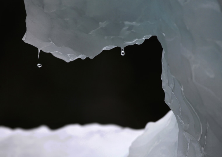 FILE - In this July 26, 2011 file photo, drops of water fall from a melting iceberg near Nuuk, Greenland. Greenhouse gases more powerful than carbon dioxide are the focus of a global gathering this week in Rwanda, with Secretary of State John Kerry expected to arrive Thursday, Oct. 13, 2016 to apply pressure for a deal to quickly phase out hydrofluorocarbons which are used in air conditioners, refrigerators, and insulating foams. (AP Photo/Brennan Linsley, File)