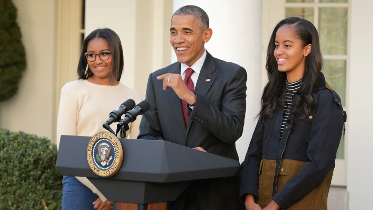President Barack Obama with his daughters Sasha and Malia
