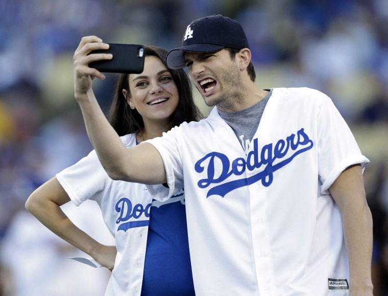 Mila Kunis wears pretty camisole as she catches a Dodgers game with fiance  Ashton Kutcher