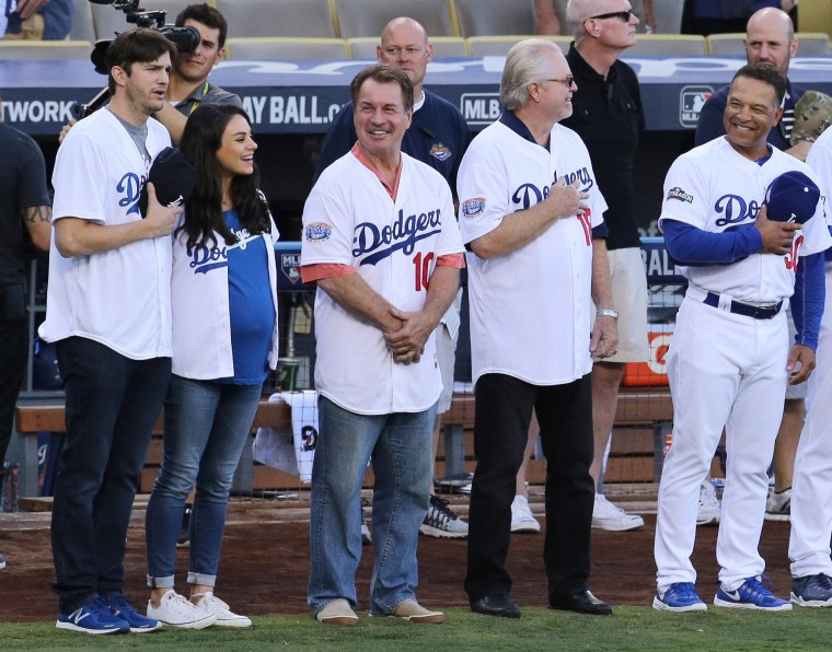 Pregnant Mila Kunis Brings Huge Baby Bump to Dodgers Game with