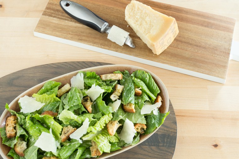 Caesar salad with cheese curls made with a vegetable peeler