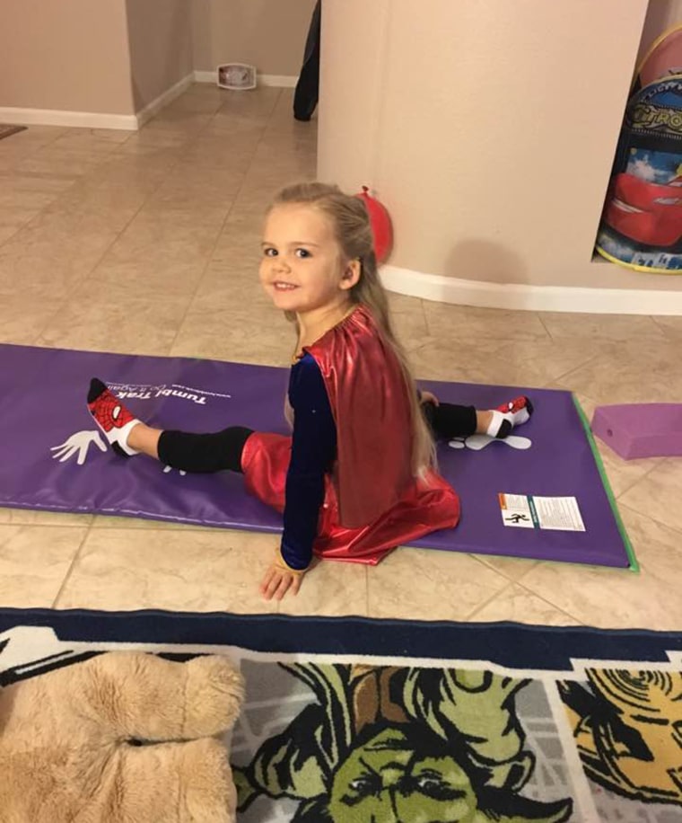 3-year-old refuses to wear anything other than her Supergirl costume for school picture day.