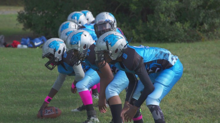 Players from the Titans youth football program