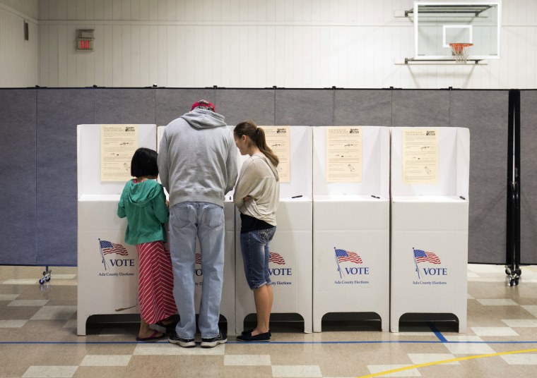 Image: A man votes during the primary election in Idaho