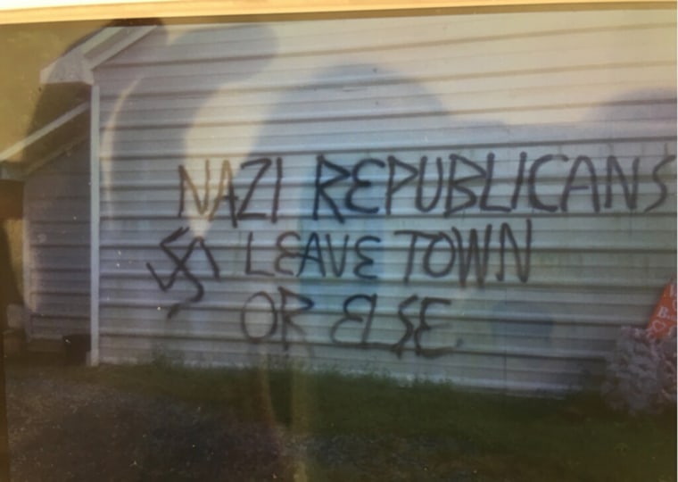 Image: Graffiti on the exterior of the Republican Party office in Orange County, North Carolina