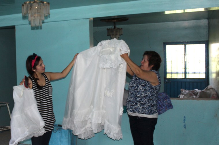 Griselda Nevarez's mother's white wedding dress, still in her house, in good shape, 20 years later.