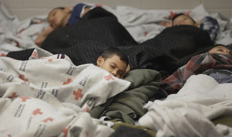 Image: Detainees sleep in a holding cell at a U.S. Customs and Border Protection processing facility