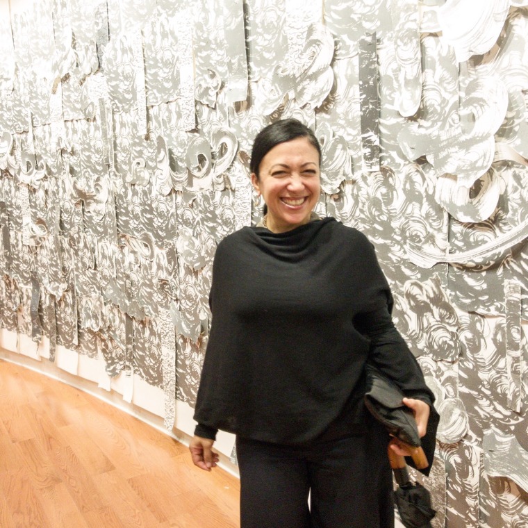 Artist Scherezade Garcia in front of her piece entitled, "Sea of Wonder" in CCCADI's inaugural exhibition, "Home, Memory, Future."