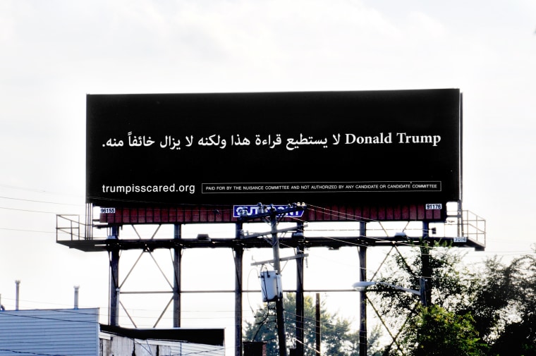 The billboard by the Nuisance Committee super PAC sits on I-94 in Dearborn, Mich.