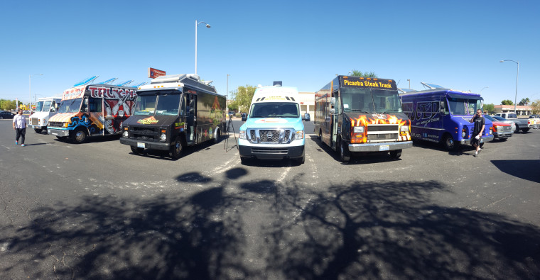 Photo of taco trucks parked in Las Vegas, drawing in potential eligible voters to register people to vote.