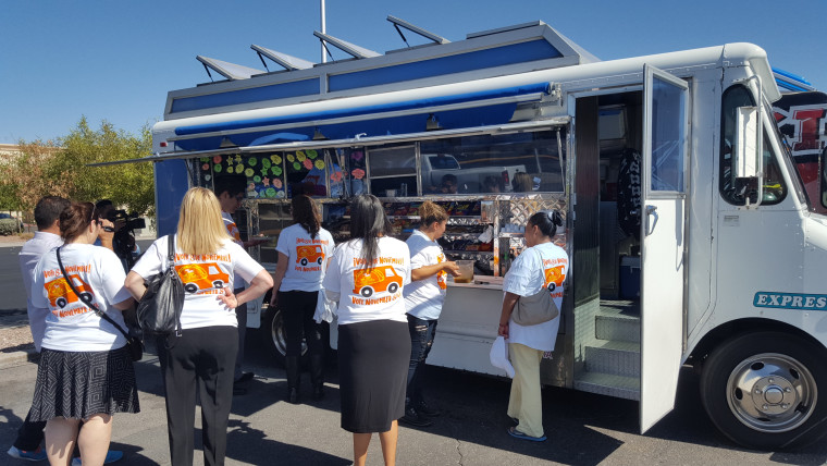 Volunteers and patrons lining up for the taco truck voter registration drive in Nevada.