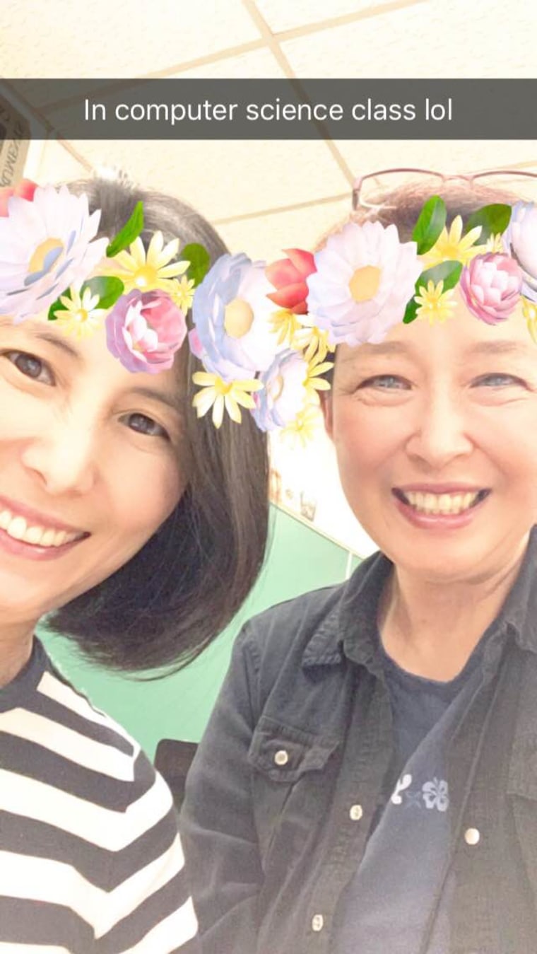 Frances Kai-Hwa Wang and Jung Q Kim getting in trouble for taking a Snapchat selfie to send to their daughters during the high school's curriculum night.