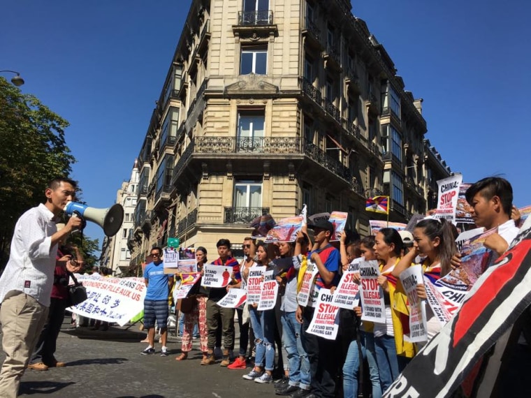 Dhondup Phuntsok, president of Students for a Free Tibet in France, addresses a group of protesters through the megaphone, in a photo dated Aug. 17, 2016.