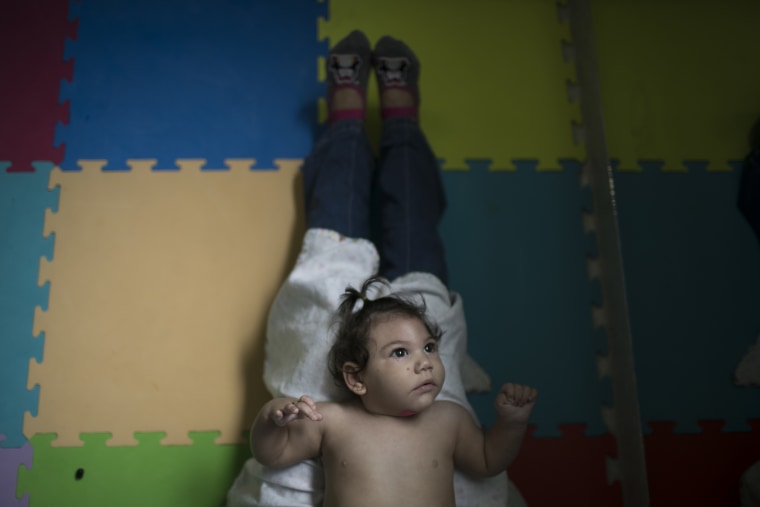Image: Angelica Pereira's 1-year-old daughter Luiza, disabled by the Zika virus