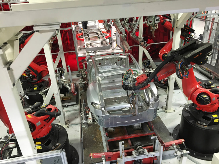 Image: Tesla vehicles are being assembled by robots at Tesla Motors Inc factory in Fremont