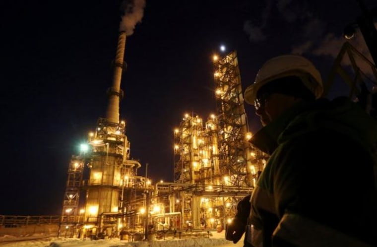 A worker looks on at the Bashneft-Ufaneftekhim oil refinery outside Ufa