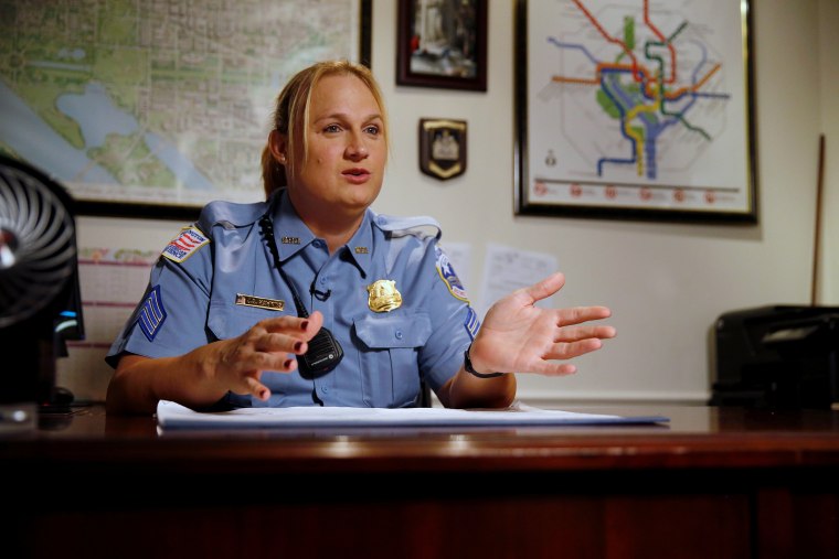 Image: Hawkins, a transgender woman who leads the department's lesbian, gay, bisexual and transgender (LGBT) unit, speaks about her work at her office in Washington