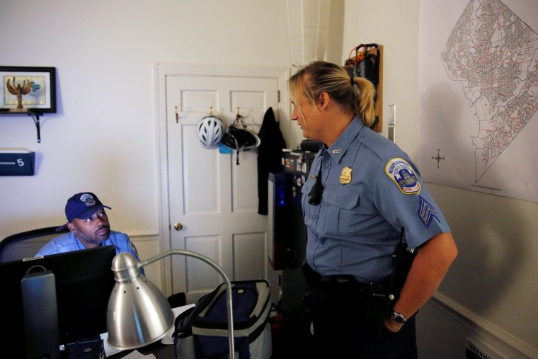 Image: Hawkins speaks with with one of her fellow officers at their office in Washington