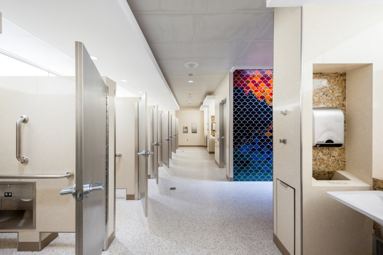 As part of a multi-year program to renovate more than 100 sets of restrooms at Minneapolis-St. Paul International Airport, the new bathrooms are lined with artist-made mosaics. 