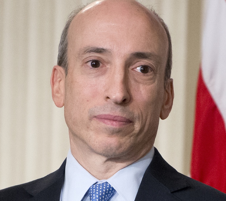 Gary Gensler, then Chairman of the Commodity Futures Trading Commission, listens to President Obama in 2013.