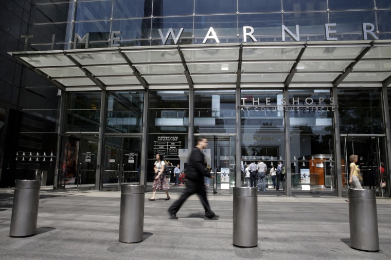 In this Tuesday, May 26, 2015 file photo, people walk by an entrance to the Time Warner Center in New York.