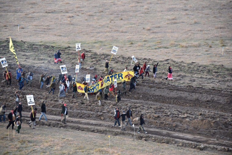 Activists march near highway 1806 in North Dakota to protest the Dakota Access Pipeline on Oct. 22.