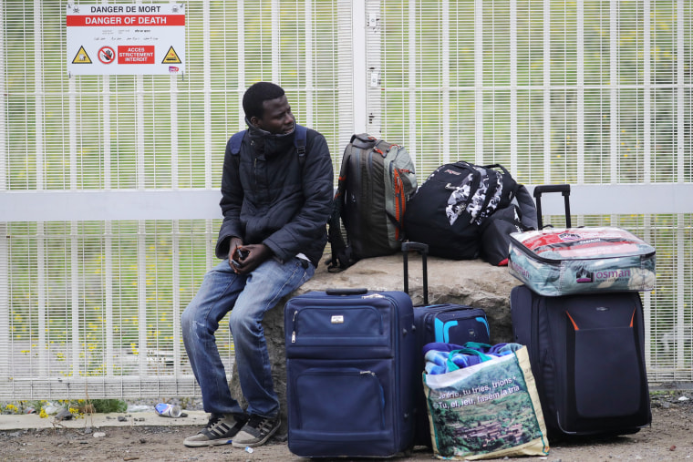 Image: Migrants Leave The Jungle Refugee Camp In Calais