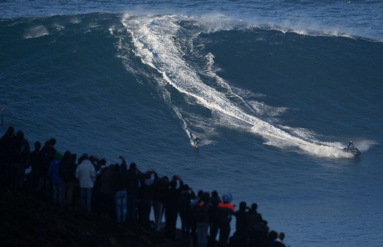 Image: TOPSHOT-PORTUGAL-SURF-WAVE