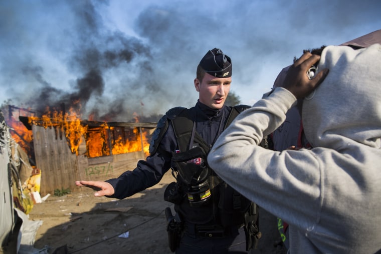 Image: Migrants Leave The Jungle Refugee Camp In Calais