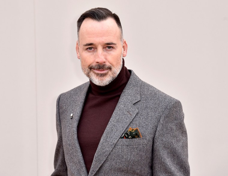 David Furnish wearing Burberry Menswear