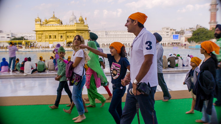 Harpreet Bedi, Satinder Garcha, and Zara Garcha at the Golden Temple in the holy city of Amritsar, India.