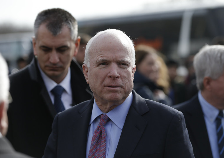 Image: U.S. Senator McCain arrives on a visit at a migrant center near the village of Adasevci