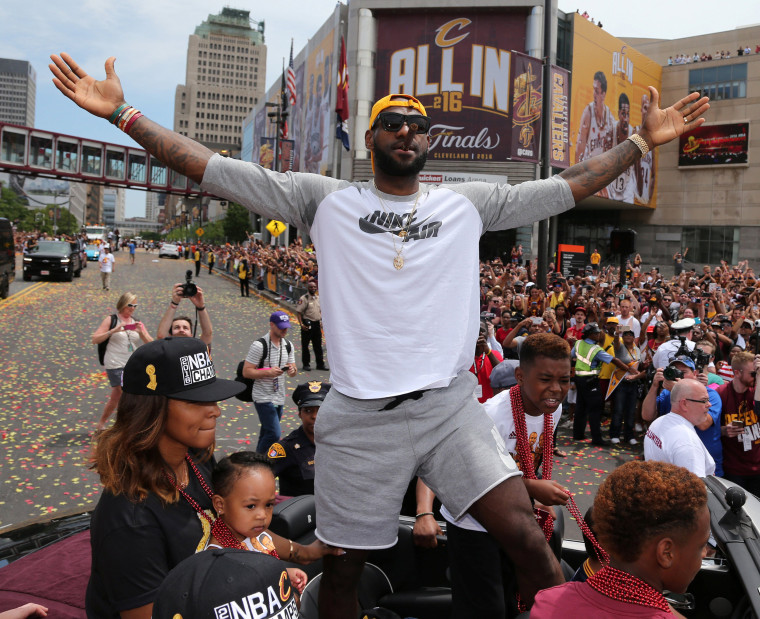 Image: Cleveland Cavaliers Lebron James celebrates with the crowd in downtown Cleveland