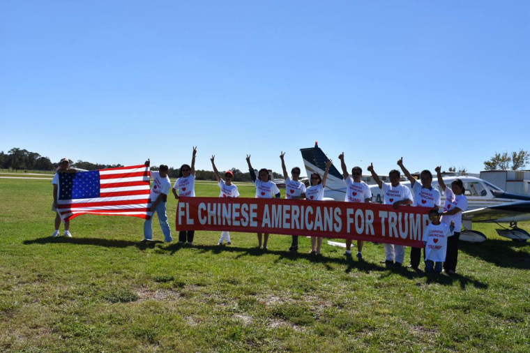 Members of Chinese Americans for Trump with a banner in the state of Florida.